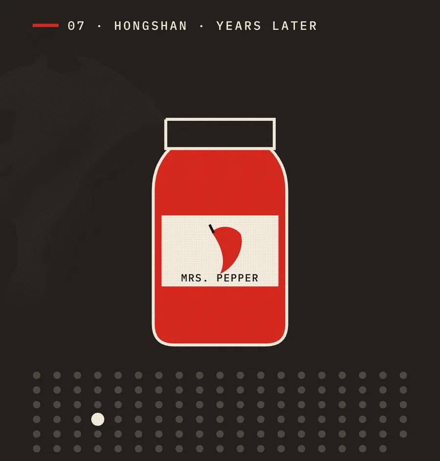 A red jar of hot sauce labelled MRS. PEPPER on a dark background